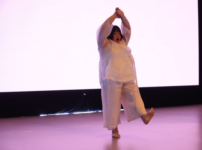 Performance still, Melati Suryodarmo," If We Were XYZ: Performing Seven Scores", 2025. Image courtesy of Tanoto Art Foundation